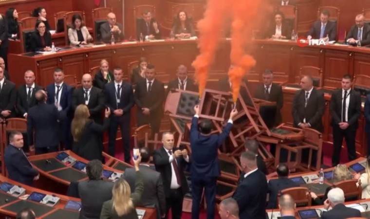 Albanian opposition lawmakers use smoke bombs in Parliament to protest 2024 budget vote