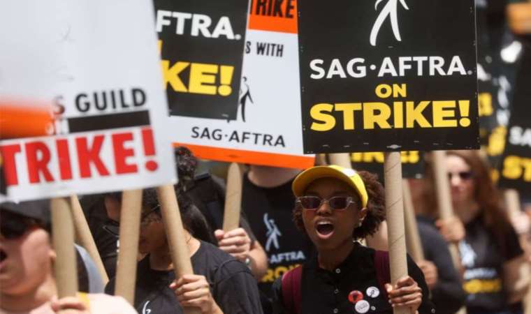 'Pay up!:' Hollywood actors, writers team on picket lines
