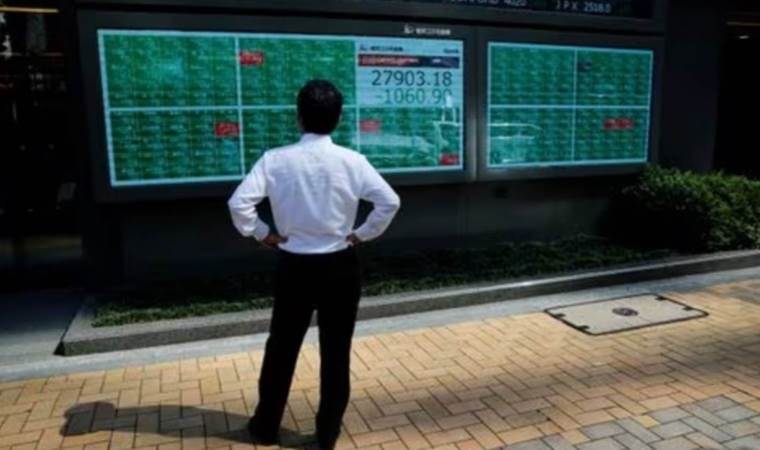 Global stocks reach two-year high, dollar weakens