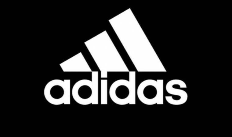 Adidas reports first loss in three decades but maintains dividend