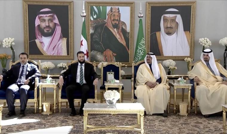 Syria's interim president makes 1st foreign visit to Saudi Arabia