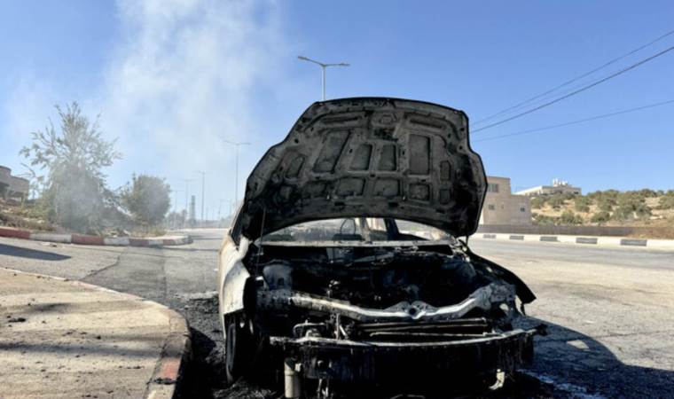 Israeli occupiers attack Palestinian man, burn vehicles